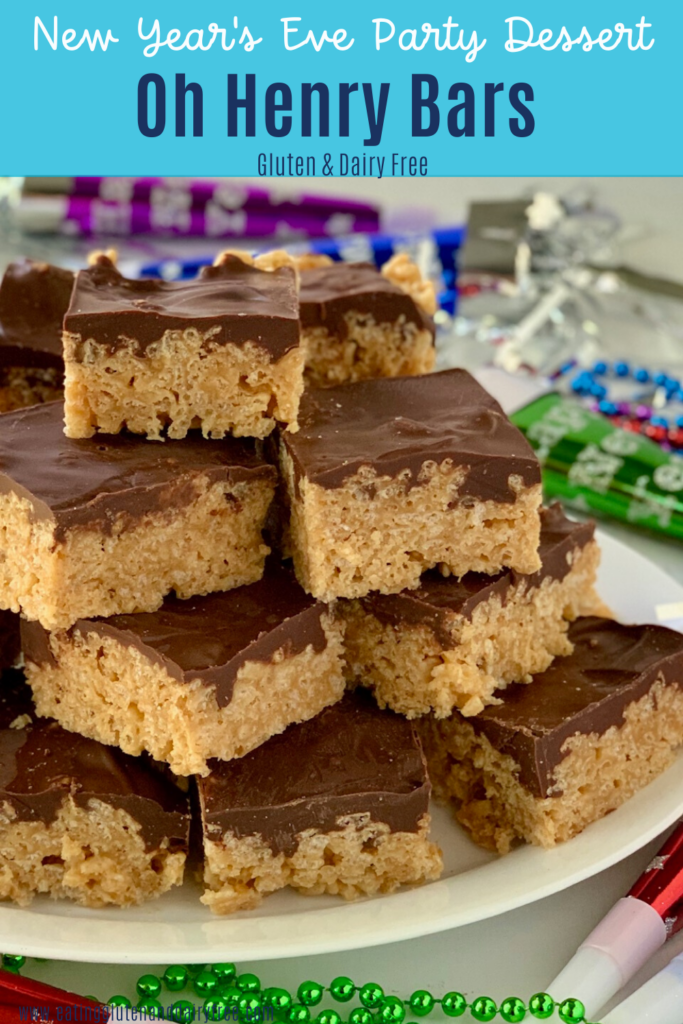 A platter full of peanut butter cereal bars with melted chocolate on top.