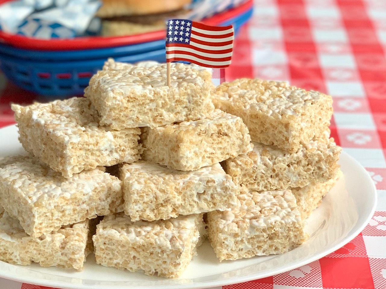 A serving plate full of stacked rice krispie squares.