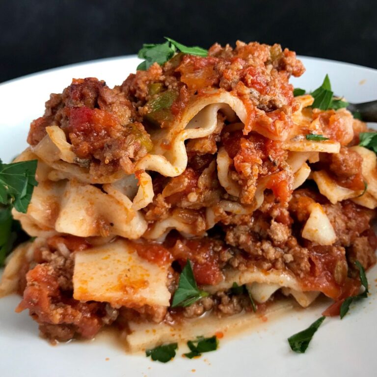 A white plate of homemade gluten free and dairy free lasagna.