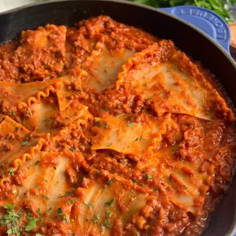 A cast iron skillet full of Gluten Free Dairy Free Lasagna.