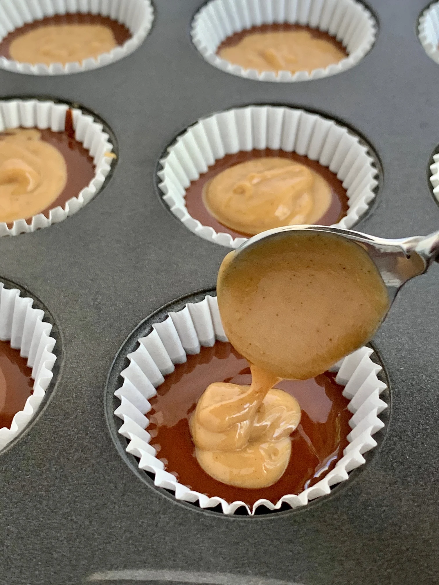 Place a peanut butter mixture on top of the melted chocolate mixture