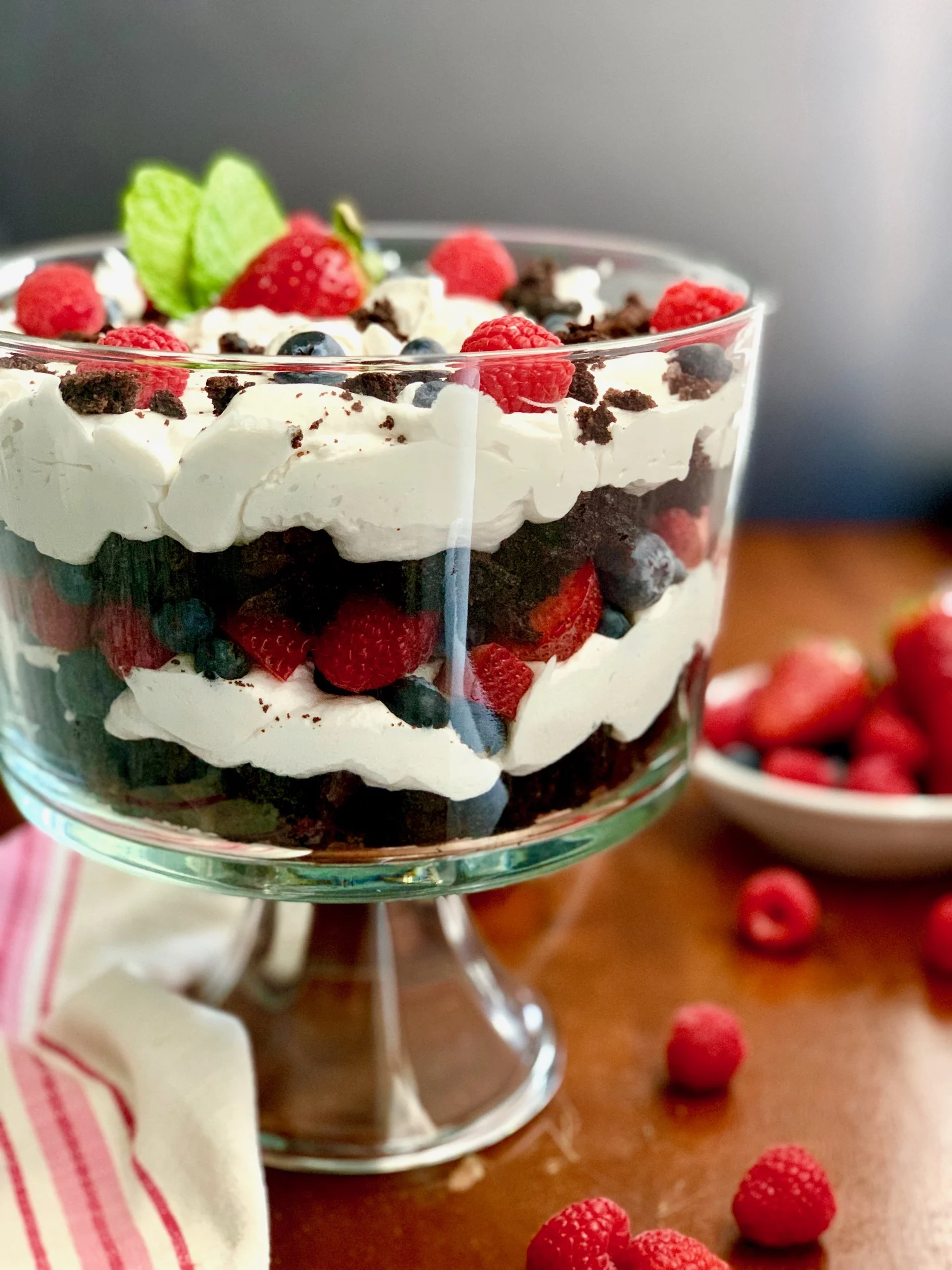 Layers of brownies, cocowhip, and strawberries and blueberries.