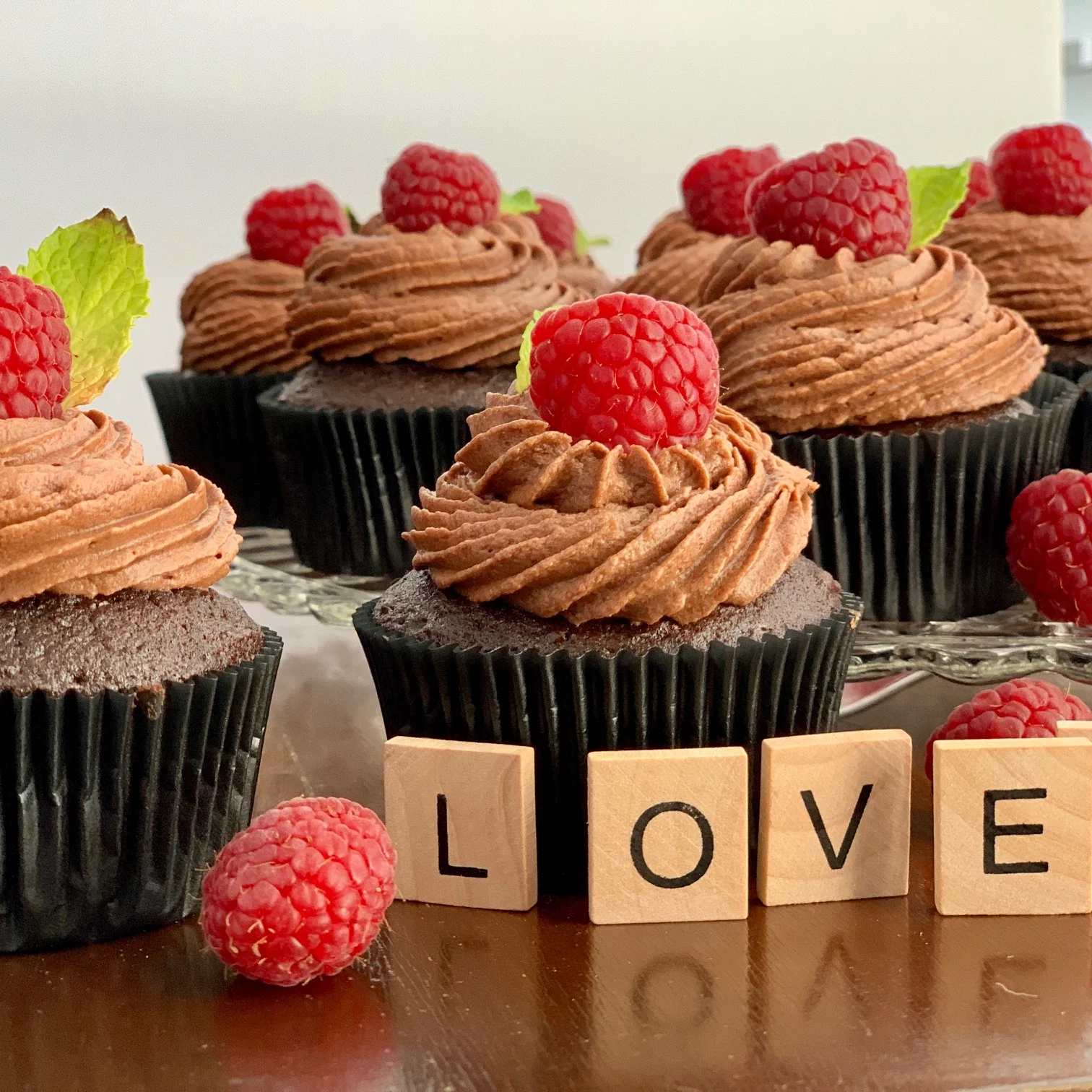 Chocolate Muffins topped with a decadent chocolate frosting.