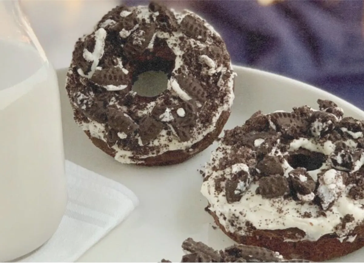 A few Oreo donuts on a white plate.