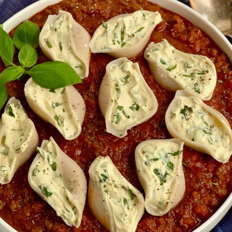 A large bowl of gluten and dairy free stuffed shells.