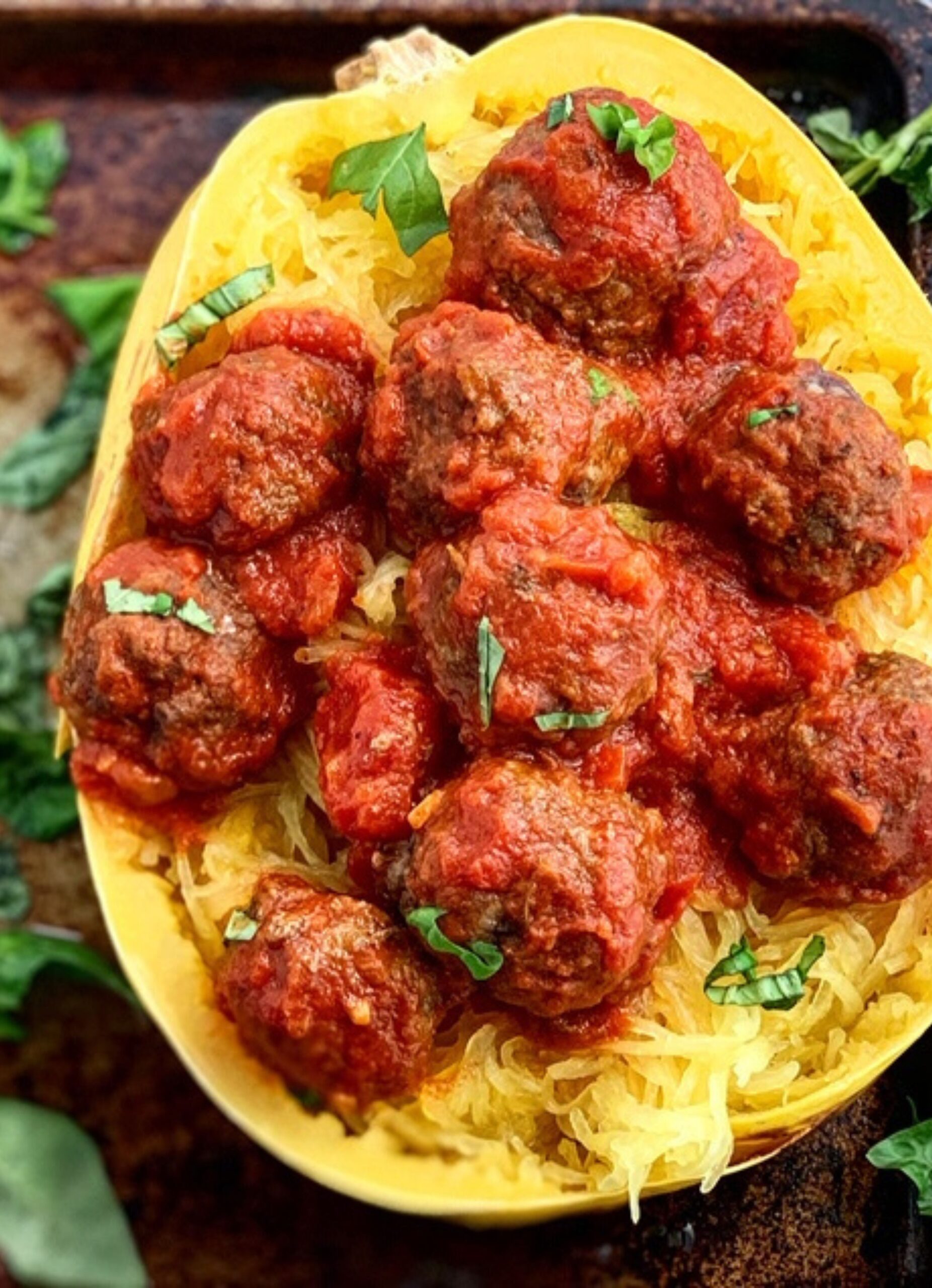 Spaghetti squash cut in half with homemade dairy free Meatballs in marinara sauce. 
