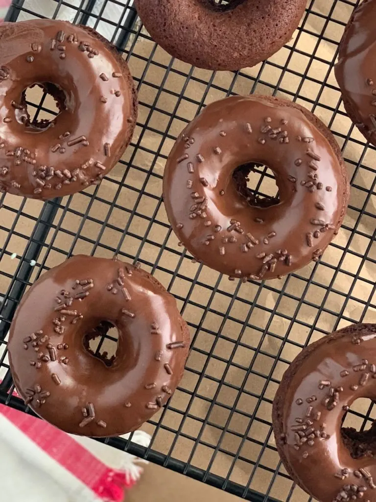 chocolate donuts with chocolate sprinkles on top