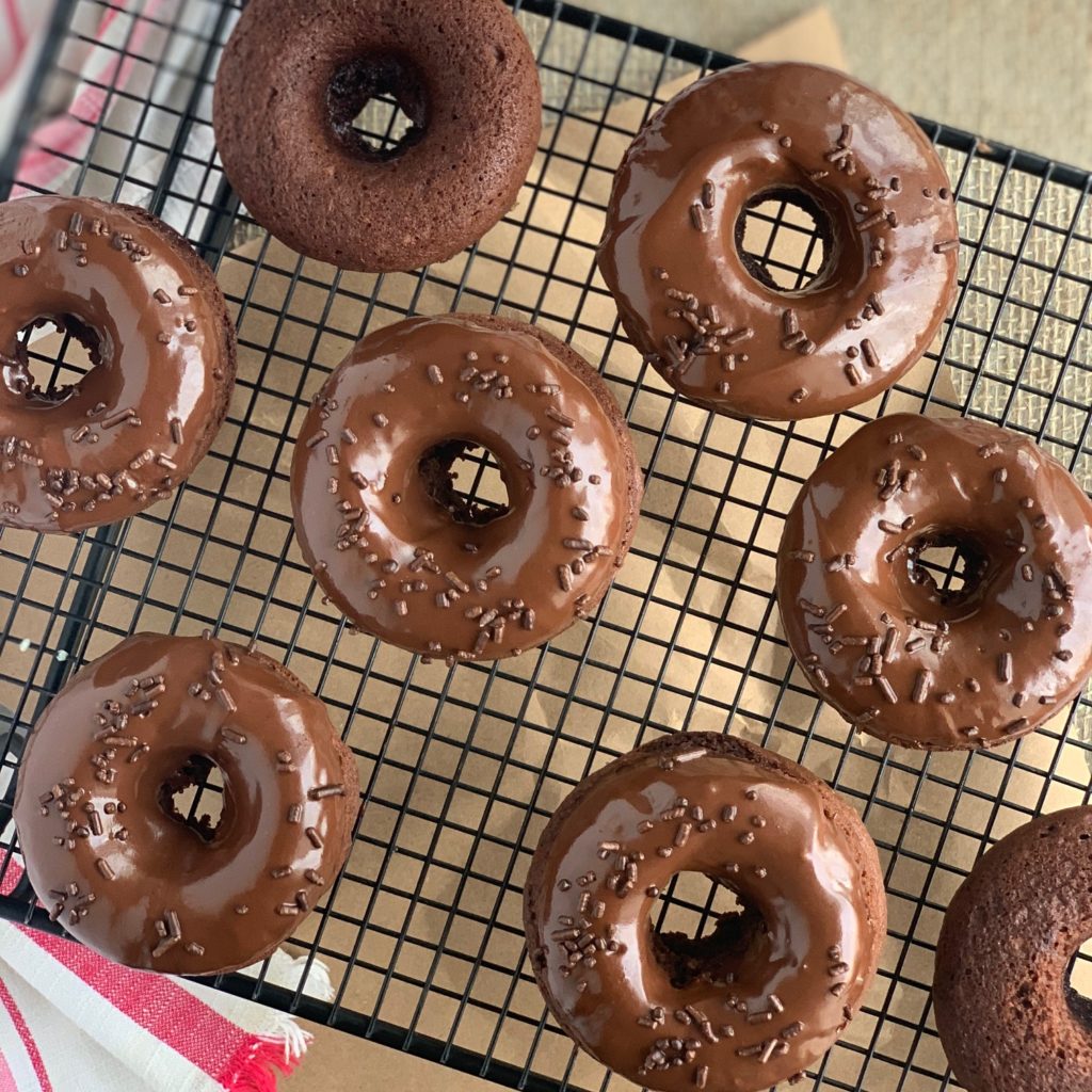 chocolate donuts with chocolate sprinkles on top