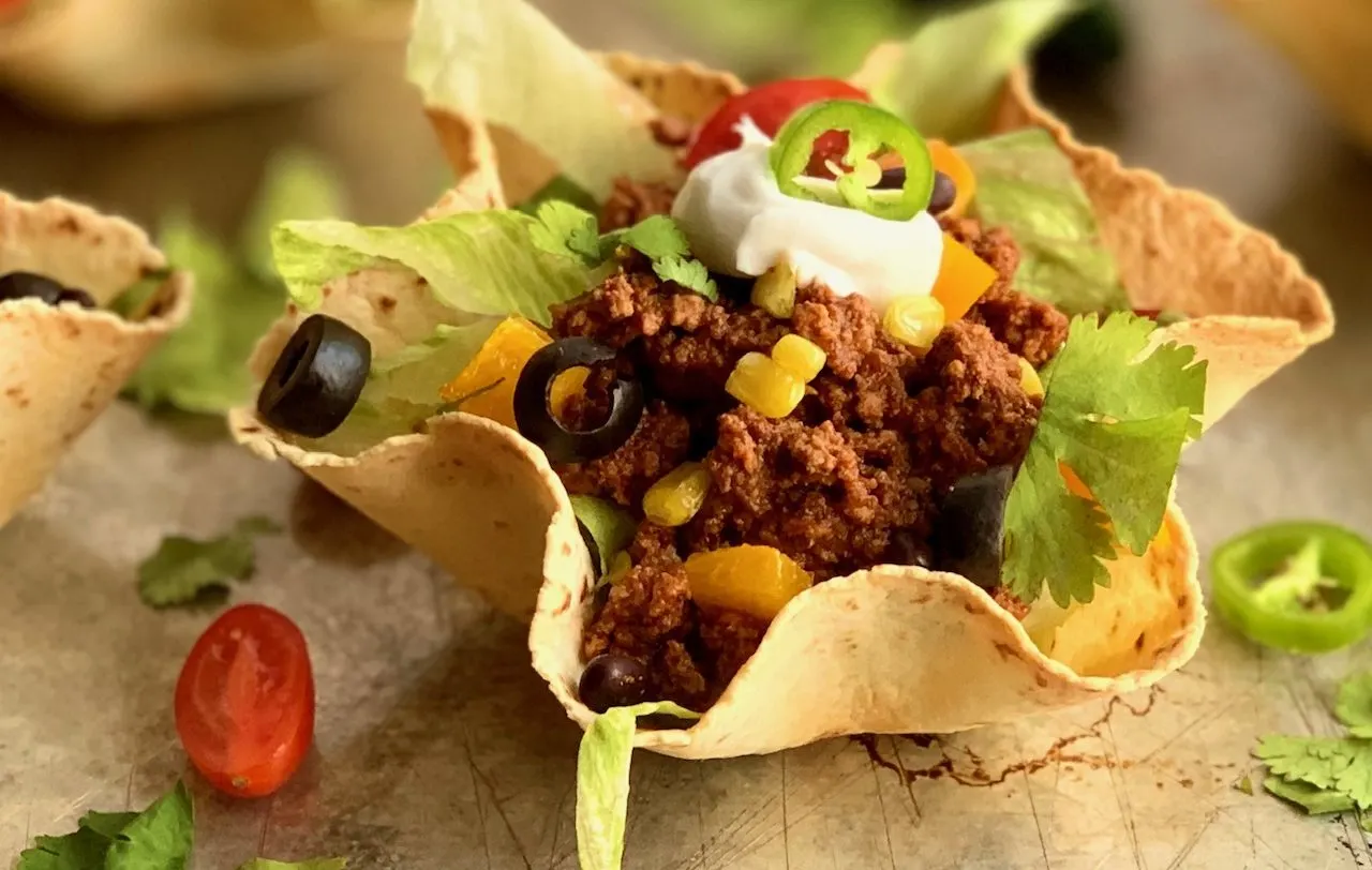 taco salad shells filled with taco meat and toppings