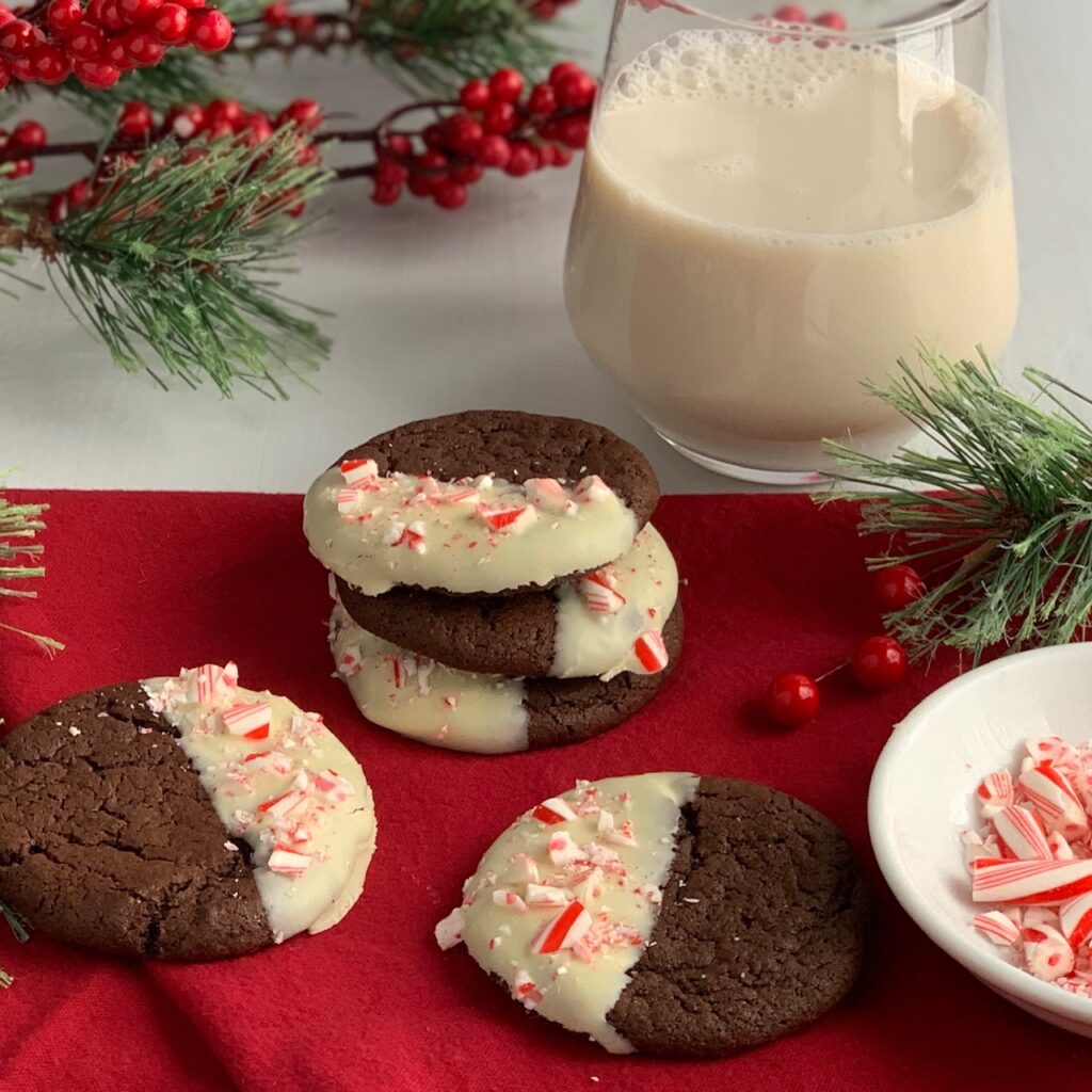 chocolate peppermint cookies dipped in melted white morsels with crush candy canes