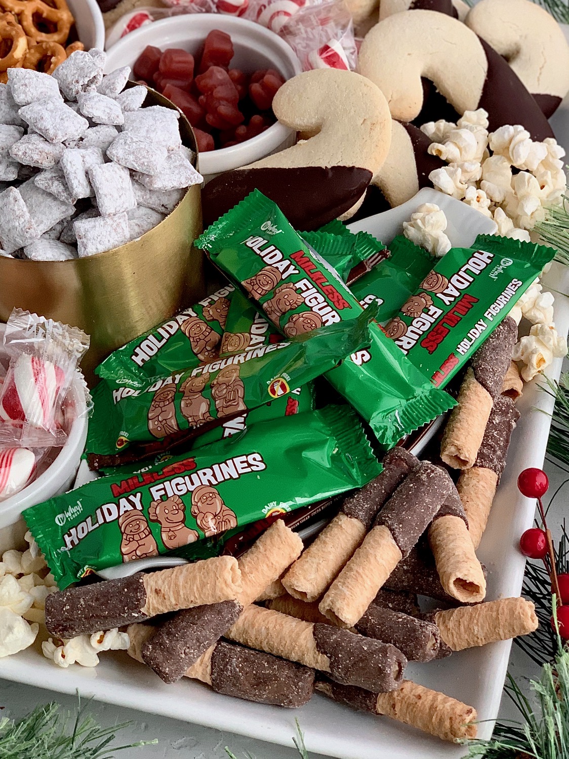 a close up of gluten and dairy free treats on a Christmas dessert board.