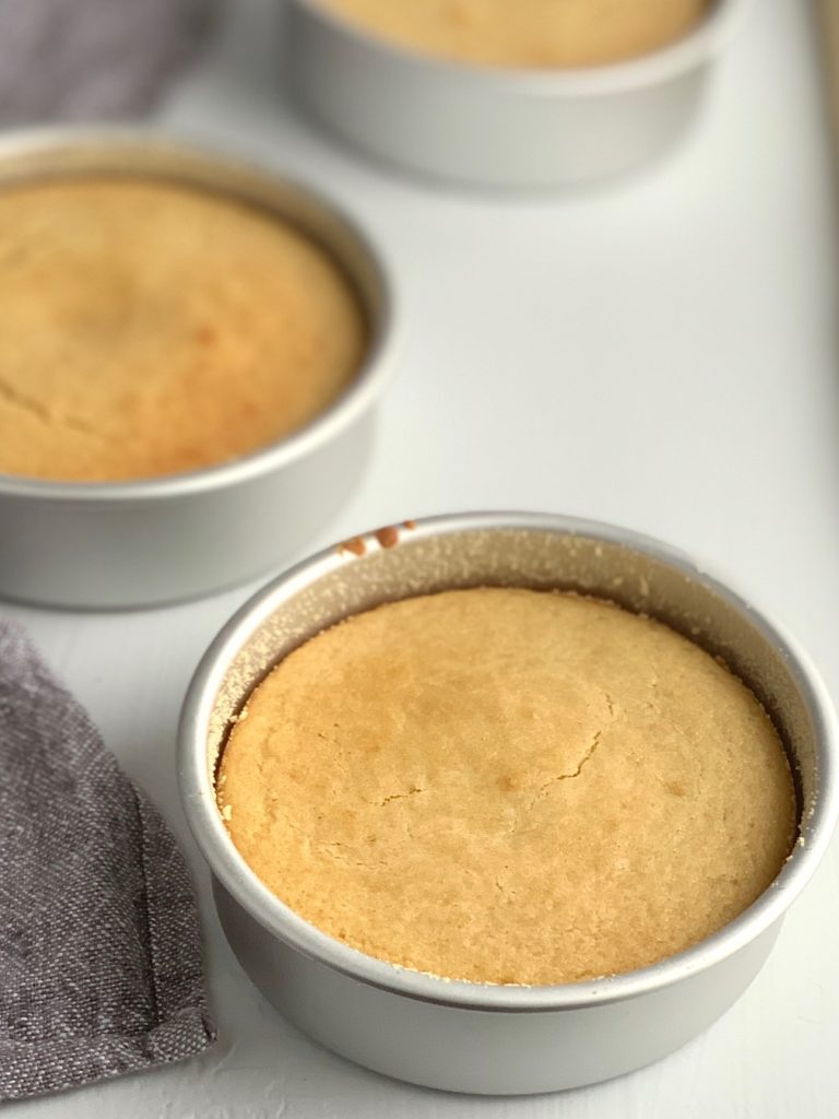 3 vanilla cakes in cake pans