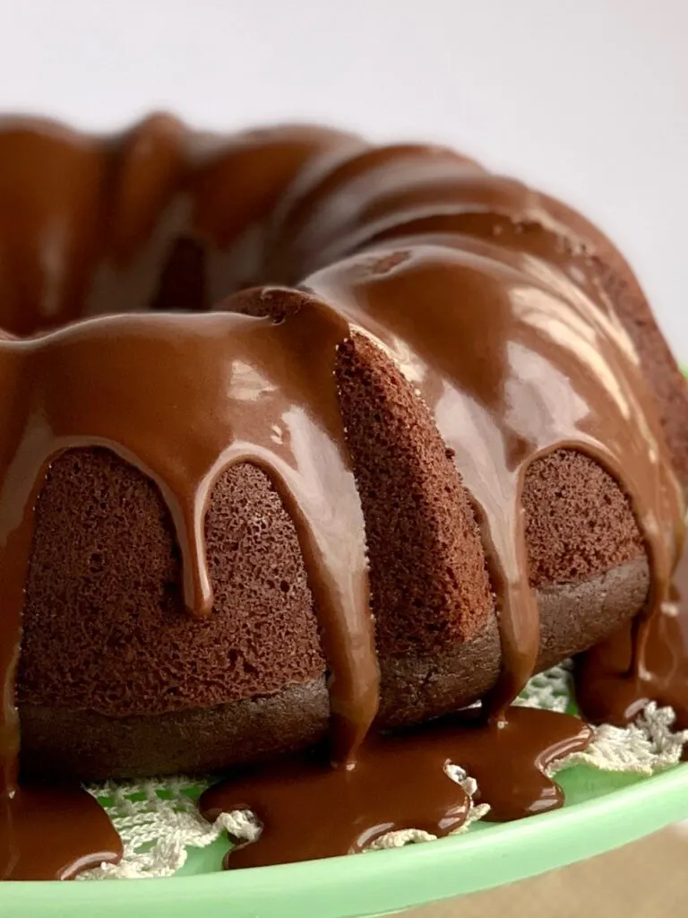 chocolate ganache drizzle on a chocolate fudge bundt cake