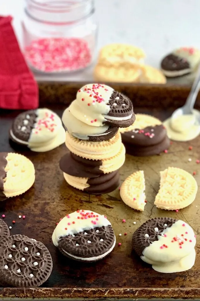 gluten and dairy free oreo sandwich cookies dipped in dairy free chocolate with sprinkles