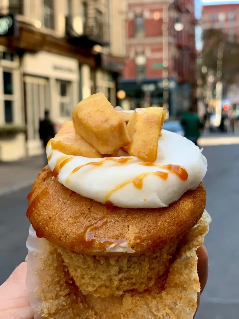 apple topped cupcake with vanilla frosting