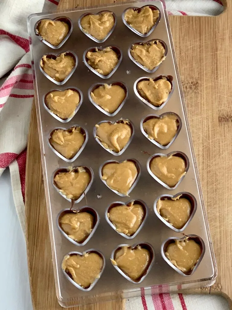 chocolate and peanut butter in heart candy molds