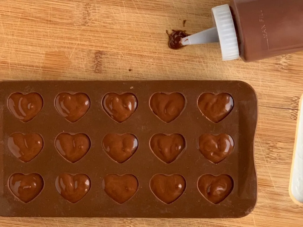 melted chocolate in a heart mold