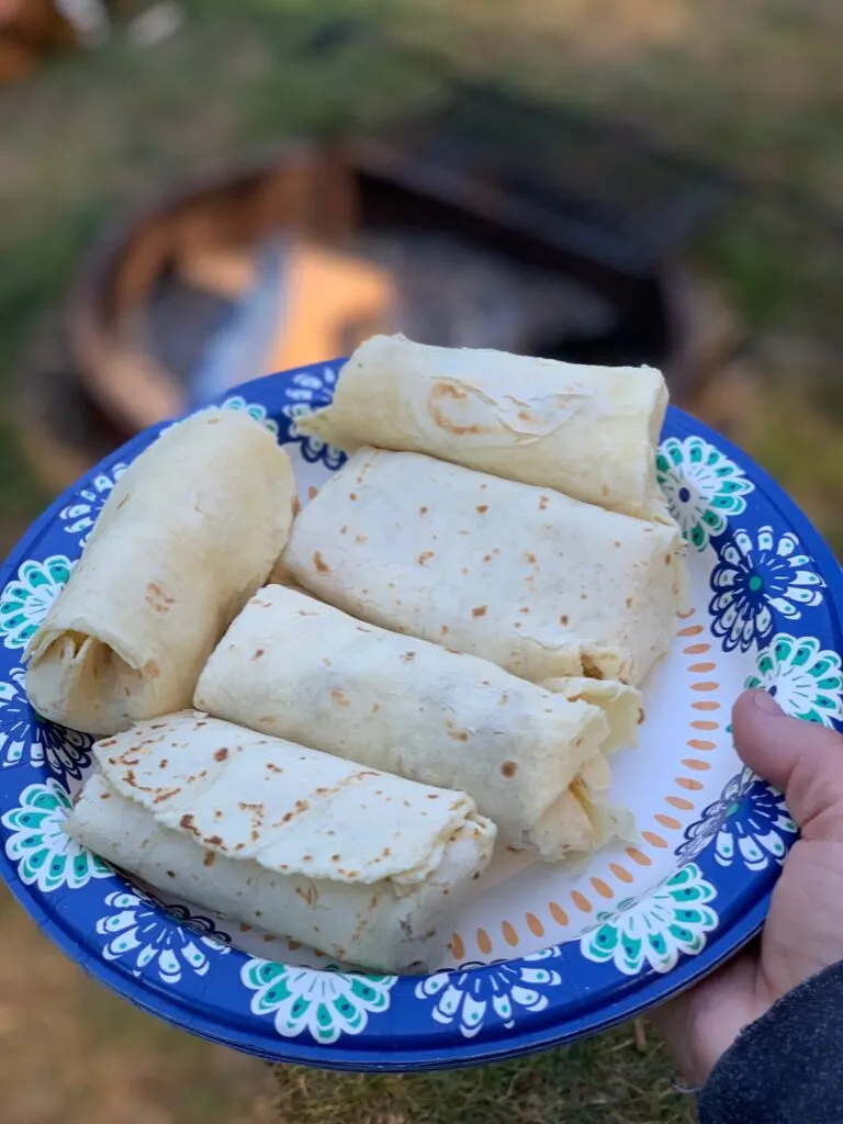 A plate full of breakfast burritos