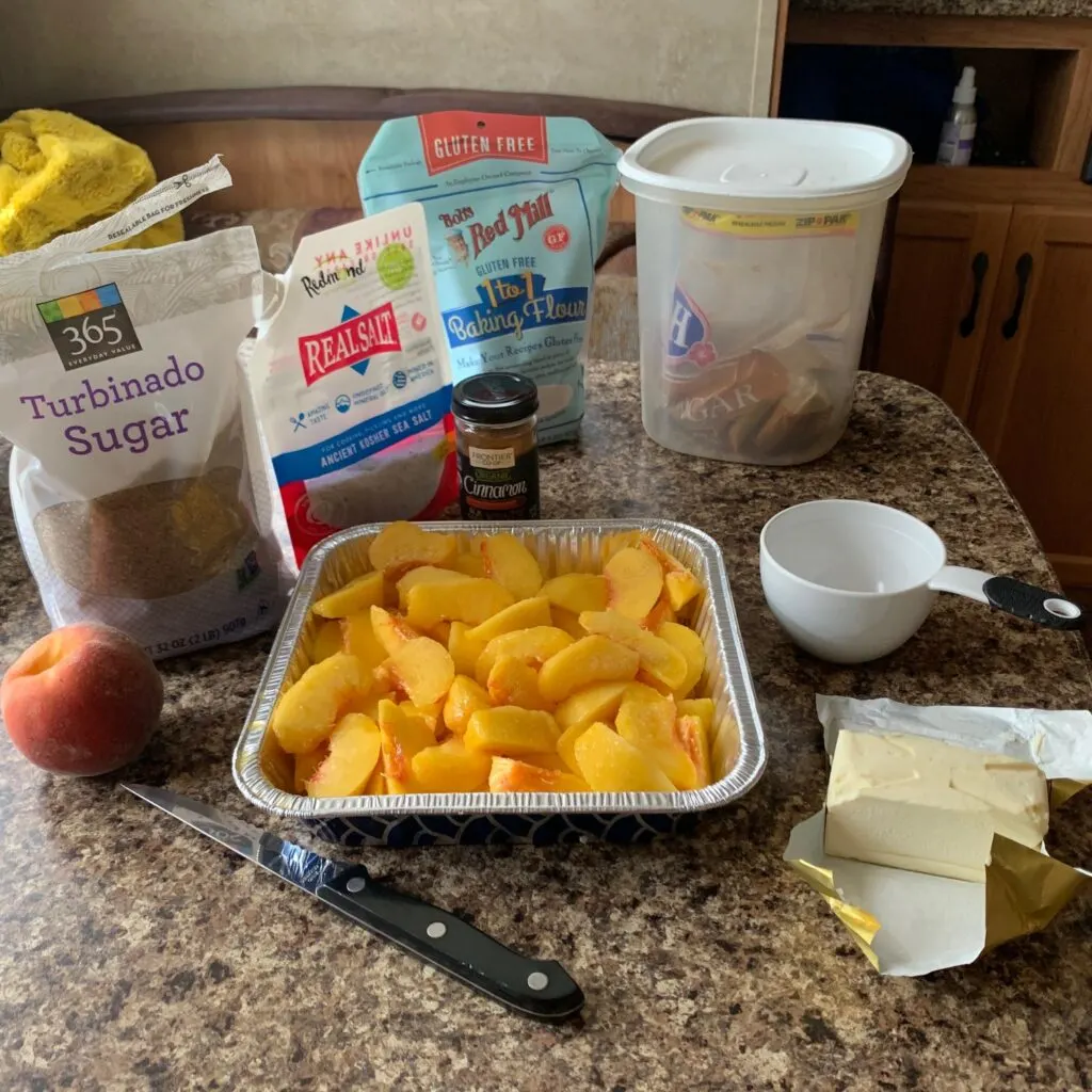 All of the ingredients for baking a fresh peach crisp