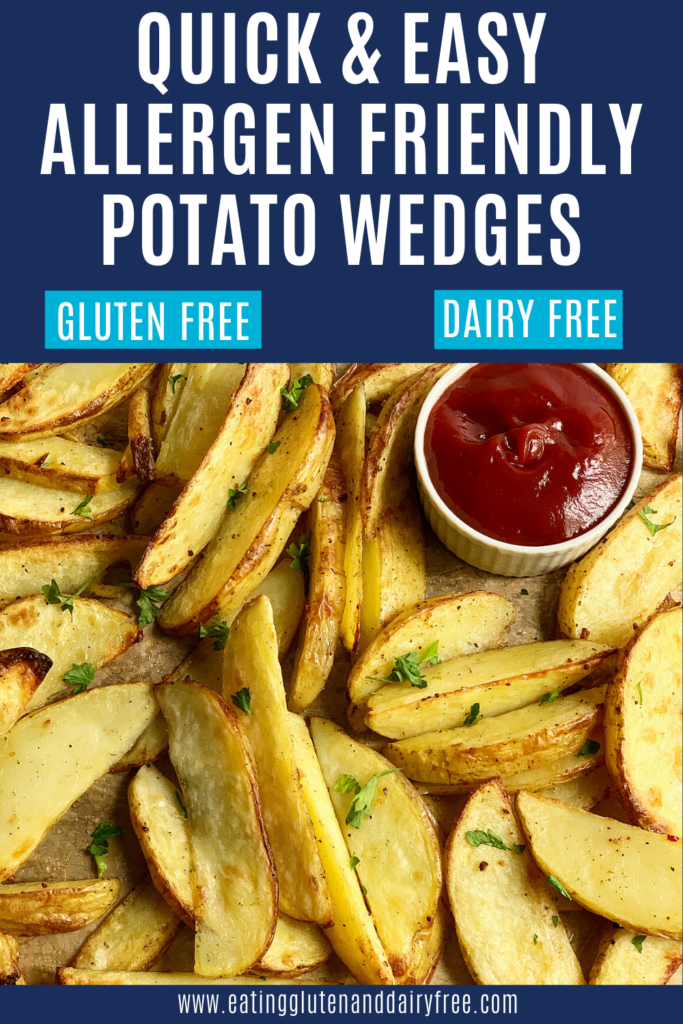 A baking sheet full of baked potato wedges garnished with dried parsley with a small container of ketchup.