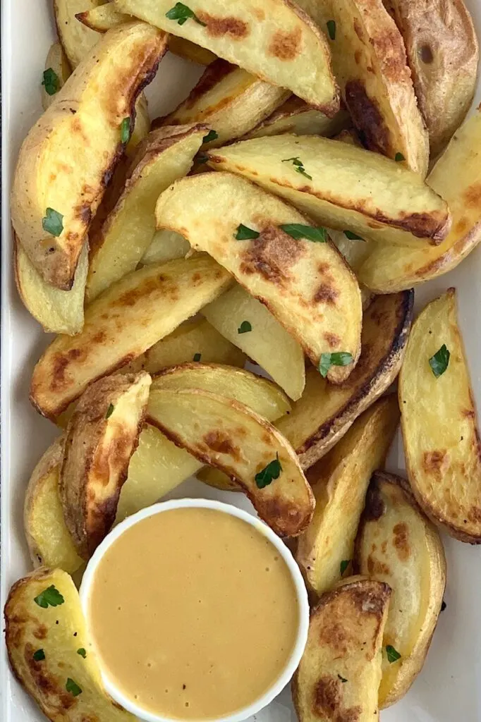 Homemade Chick-Fil-A Sauce served with baked potato wedges