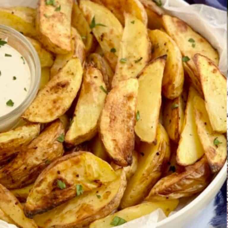 A bowl of gluten free potato wedges.