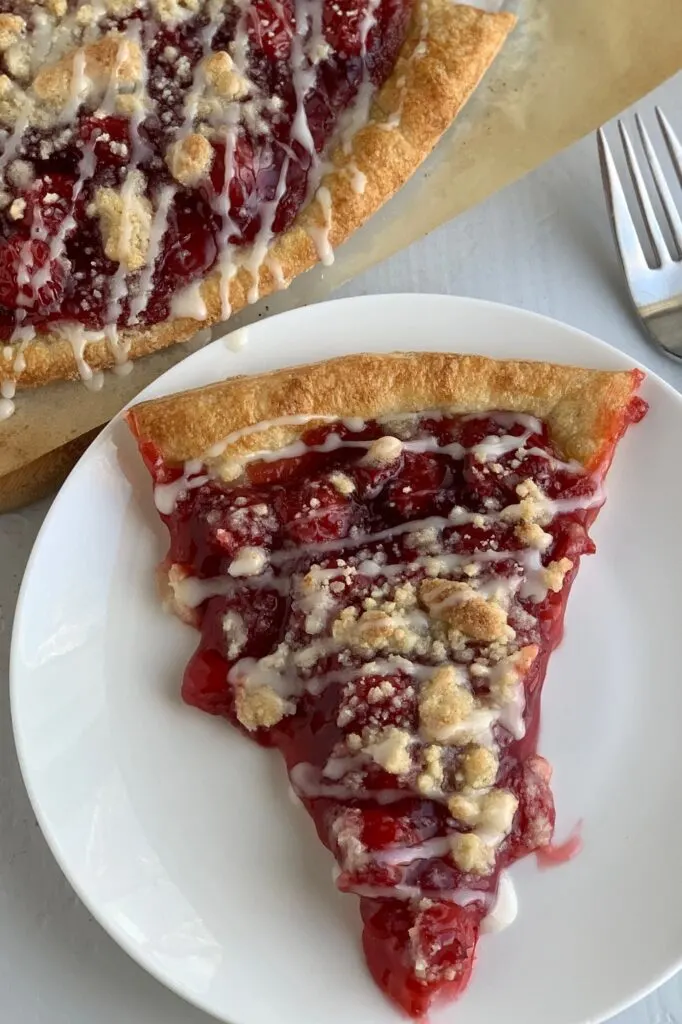 a slice of cherry dessert pizza