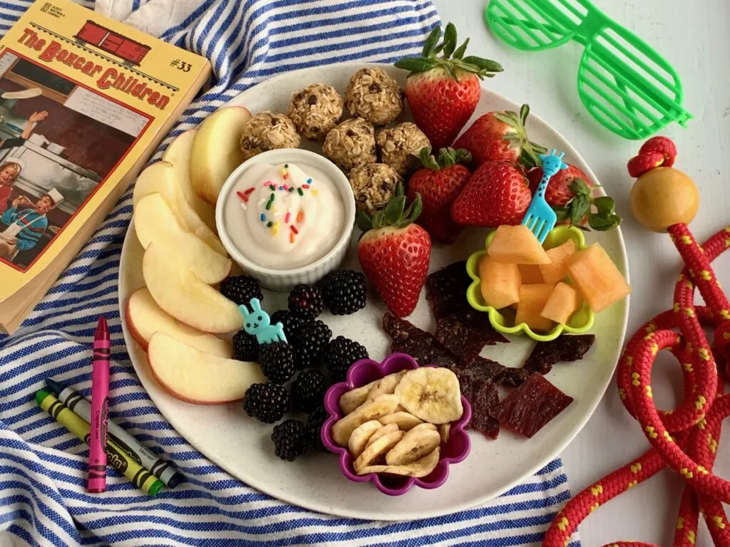 Several kid friendly snack ideas on a plate