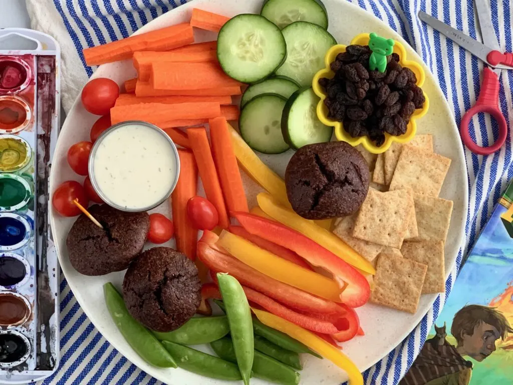 Several kid friendly snack ideas on a plate