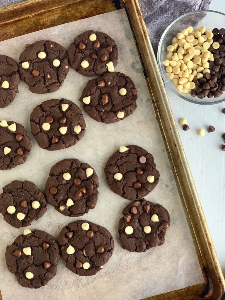 White chocolate chip cookies on a cookie sheet.