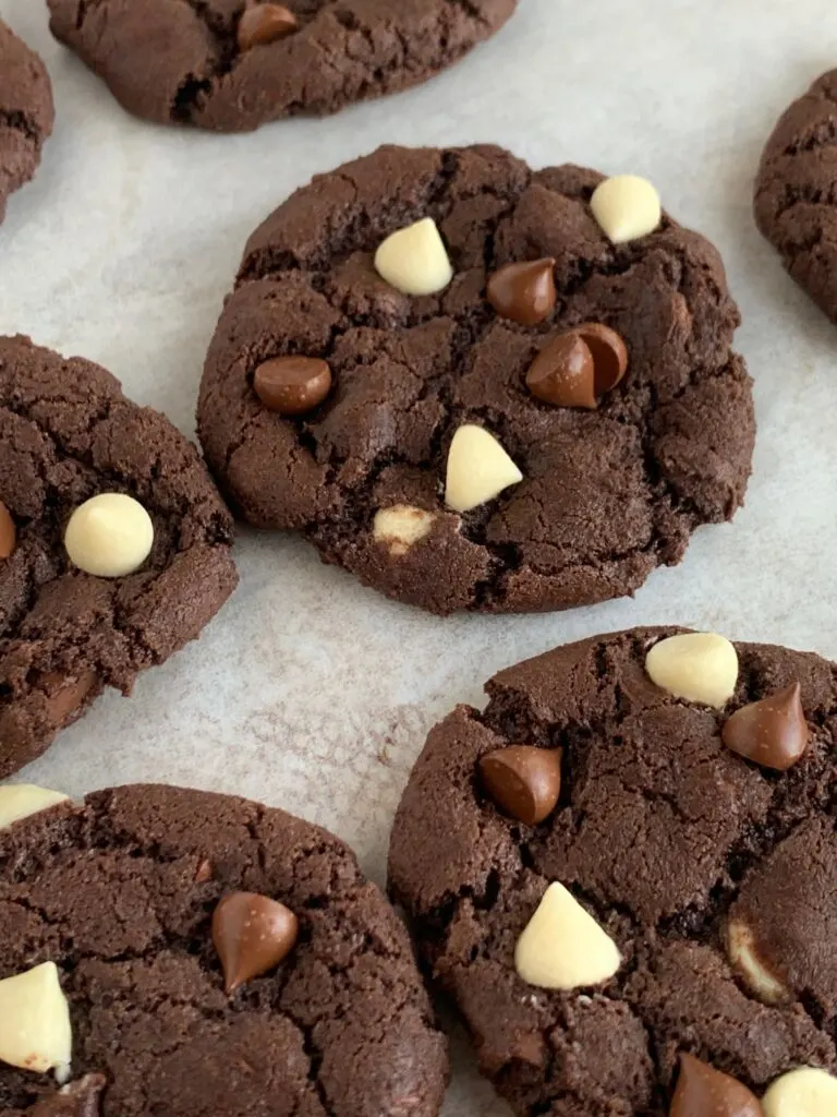 White chocolate chip cookies on a cookie sheet.