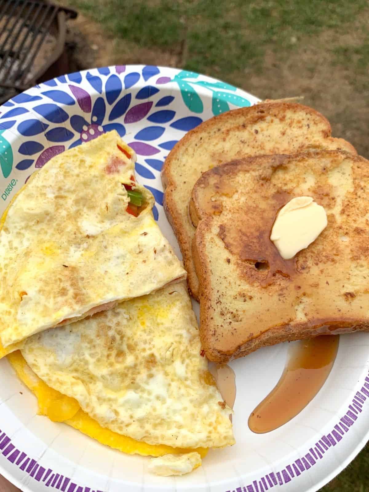 French toast and eggs on a plate.