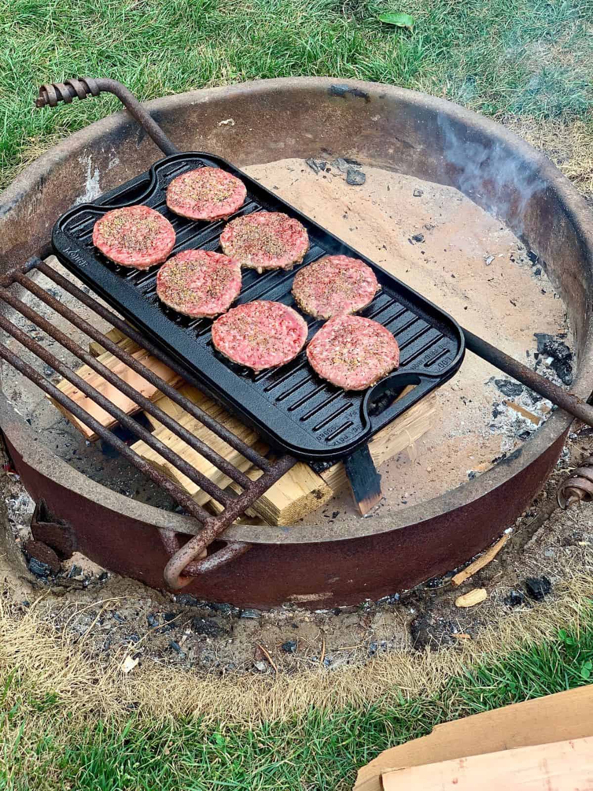 Burgers on a grill.