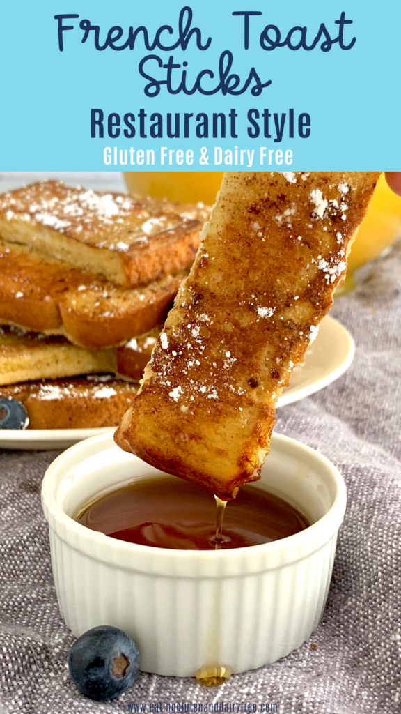 A french toast stick dipped in maple syrup