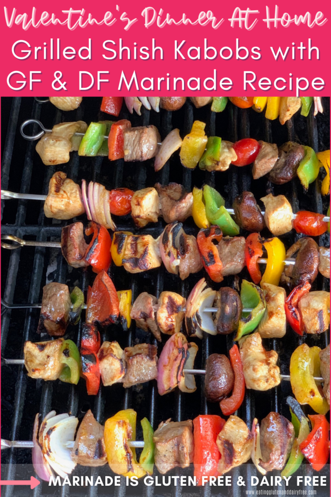 Veggies and meat on several metal skewers being grilled.