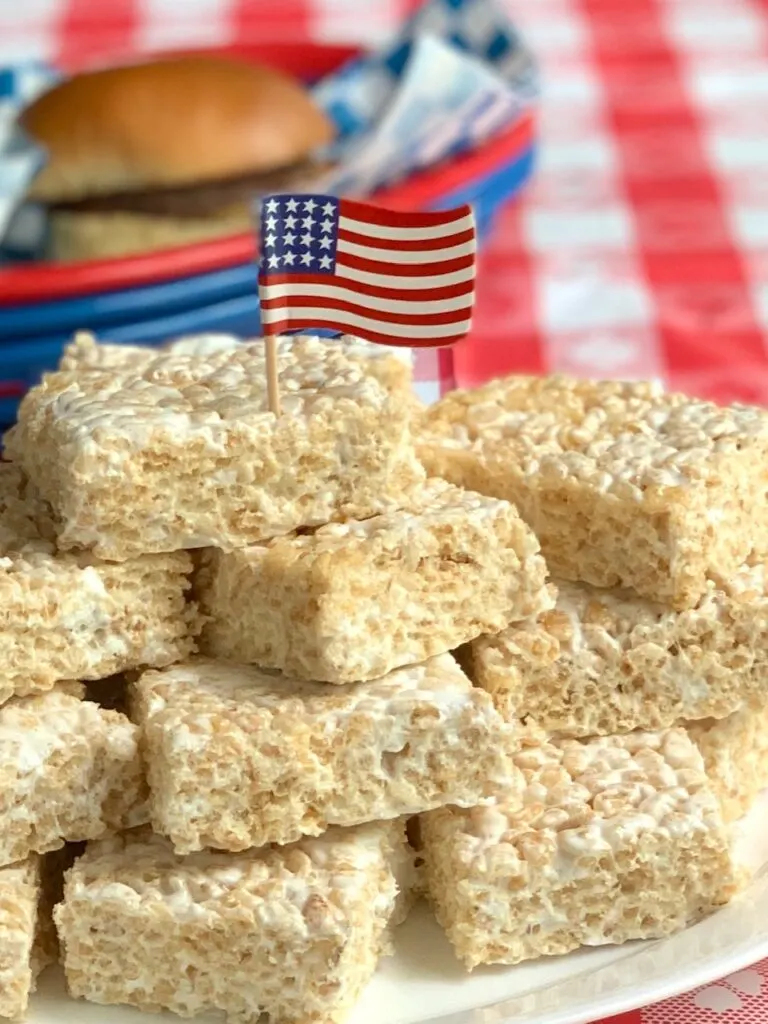 rice krispie squares cut and on a platter with 4th of July decorations