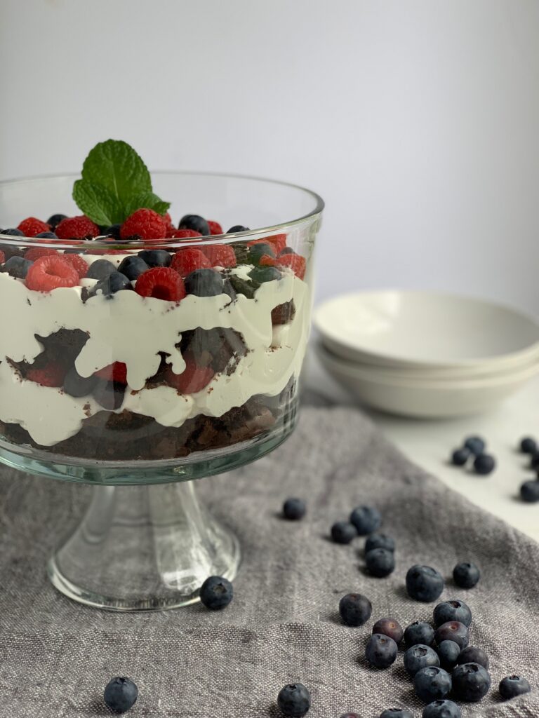 brownie, cocoawhip, blueberries, and raspberries layered in a trifle.