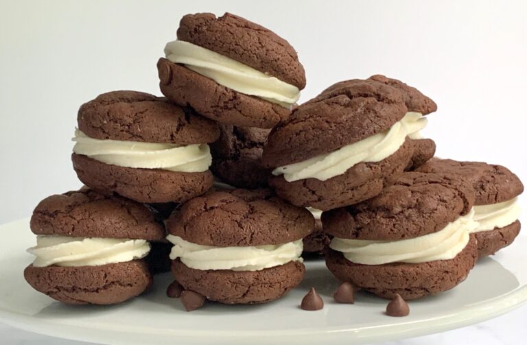 A plate of brownie cookie sandwiches