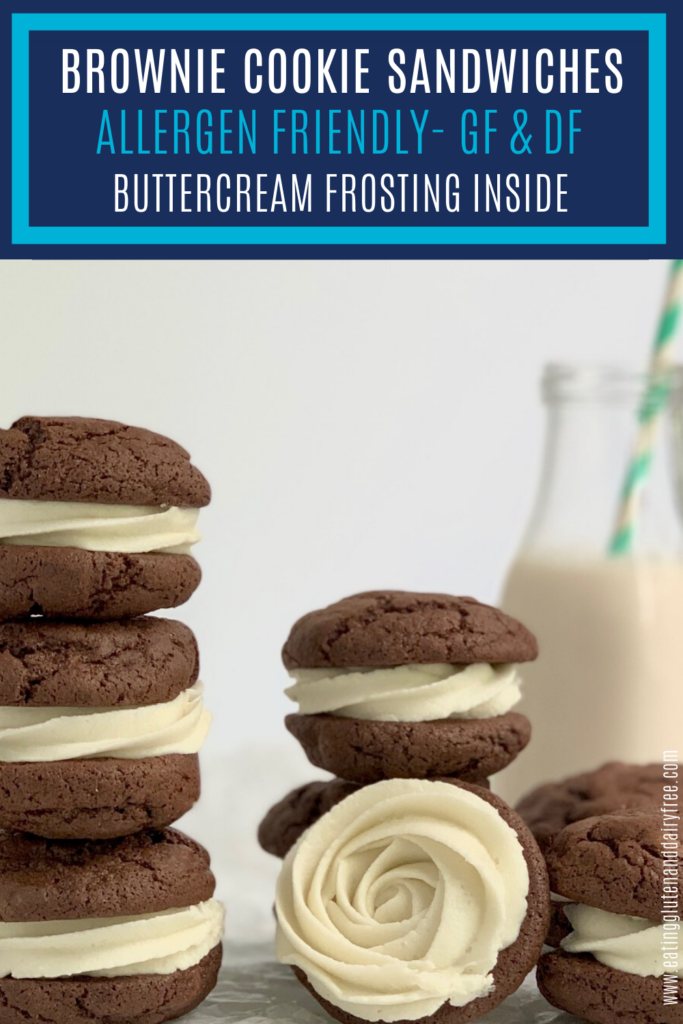 Buttercream icing sandwiched between 2 brownie cookie sandwiches.