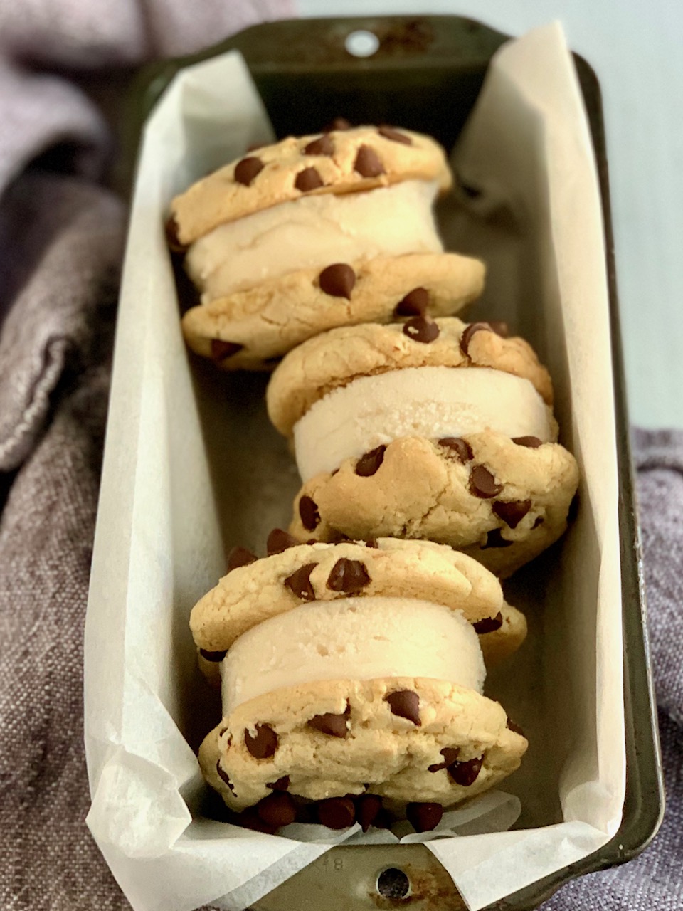A bunch of ice cream cookie sandwiches.