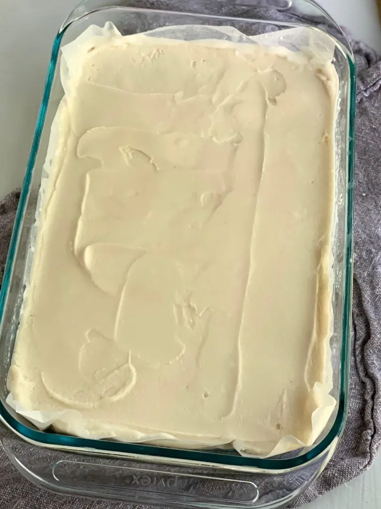 A 9 x 9 in baking pan filled with dairy free ice cream.