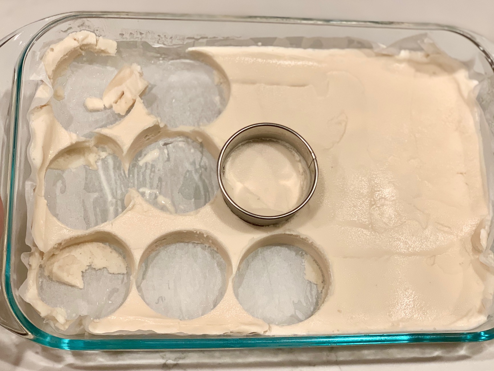 Cookie cutter cutting out stacks of ice cream.