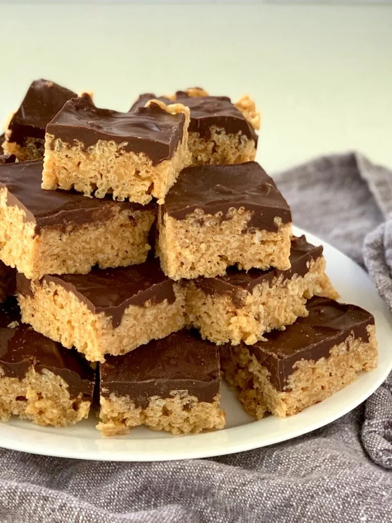 A plate of Oh Henry Bars stacked on top of each other.