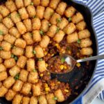 Ground beef, corn, black beans, with a mixtures of sauces and spices topped with tater tots.,