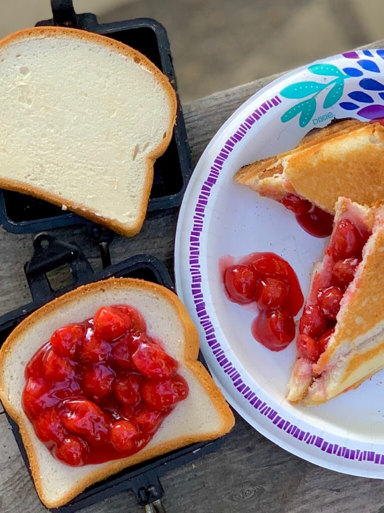 A slice of bread with cherry pie filling