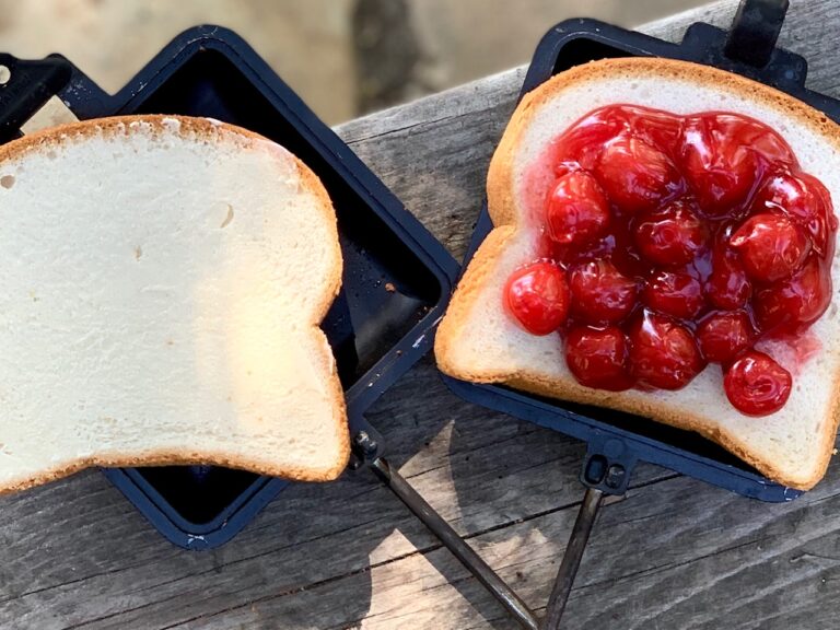 A slice of bread with cherry pie filling