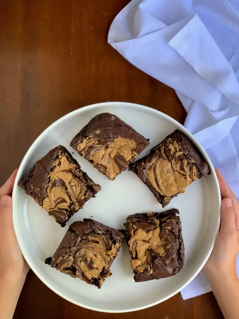 A peanut butter mixture swirled into brownie batter and backed. Cut into squares and placed on a plate. 