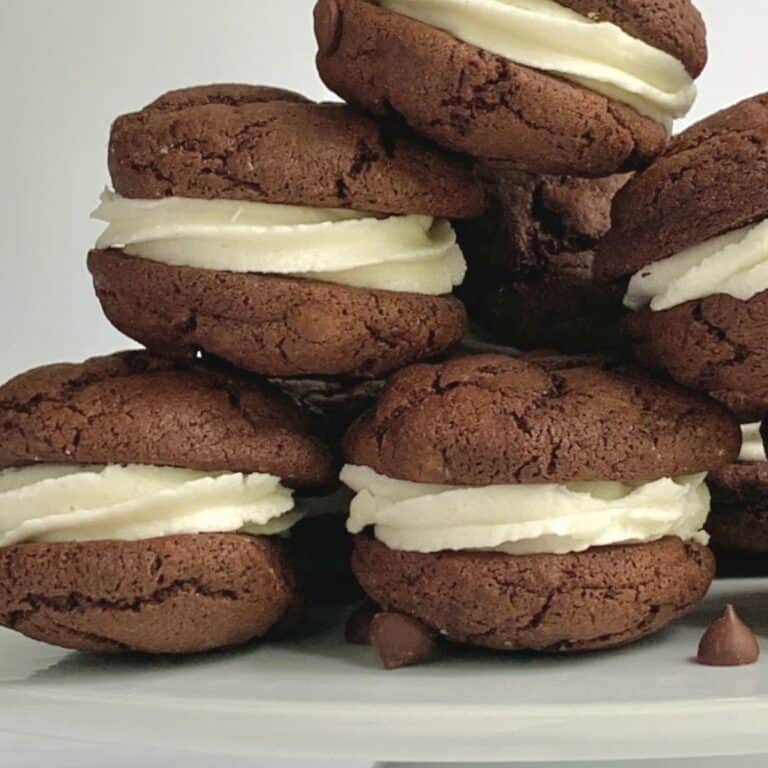 A stack of gluten free dairy free Brownie cookie frosting sandwiches.