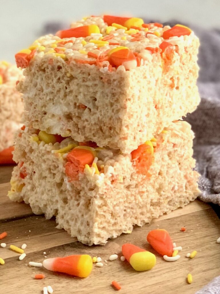 2 rice krispie treats stacked on each other with candy corns in them