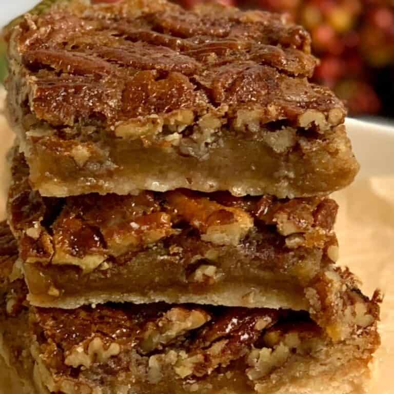 A small pile of gluten free dairy free pecan pie bars.
